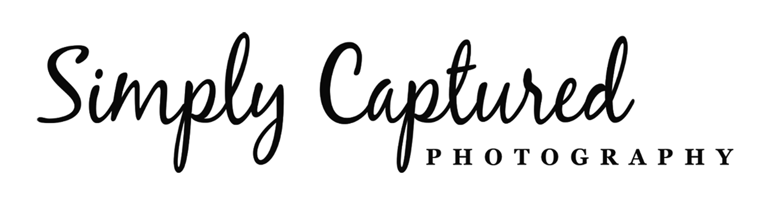 Simply Captured cursive logo with PHOTOGRAPHY in uppercase serif font on a plain background.