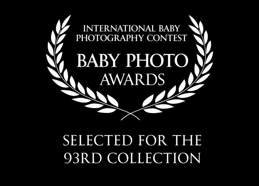 Black background, white laurel wreath, text: "Baby Photo Awards 93rd Collection." Knoxville TN photographer honored.